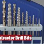 A professional extractor drill bit set case resting on a grey concrete surface for mechanical repairs.