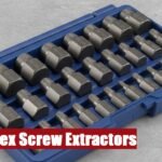 A complete hex screw extractor set case lying on a rough concrete floor for smooth workshop maintenance.