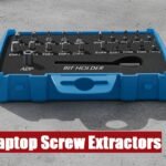 Professional laptop screw extractor kit lying on a cement background for precision computer maintenance.