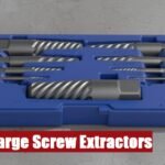 A professional large screw extractor set case resting on a rough cement floor for heavy mechanical work.