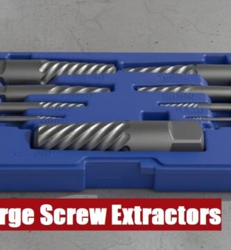 A professional large screw extractor set case resting on a rough cement floor for heavy mechanical work.