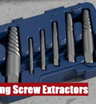 Open professional long screw extractor toolbox lying on a gray cement floor for tough fastener projects.