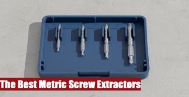 Heavy duty metric screw extractor set toolbox lying on a rough gray cement floor in a garage workshop.