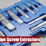 Open case containing a professional pipe screw extractor set lying on a rough industrial cement floor.