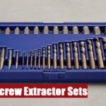 A heavy duty screw extractor set case resting on grey cement, ready for challenging mechanical repairs.