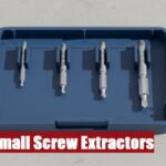 A complete small screw extractor kit box lying on a cement floor for safe and fast fastener removal.