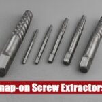 Durable snap on screw extractor kit box lying on a cement surface for efficient fastener removal tasks.