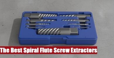 Heavy duty spiral flute screw extractor set inside an open case lying on a gray concrete floor surface.