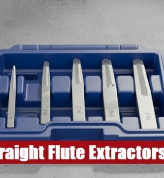 Heavy-duty straight flute extractor tool set box lying on a rough cement surface for fastener removal.