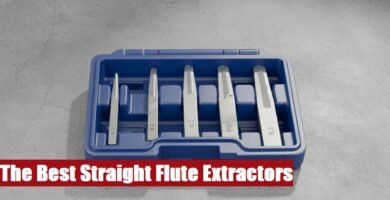 Heavy-duty straight flute extractor tool set box lying on a rough cement surface for fastener removal.
